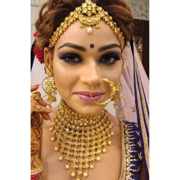 Traditional Multilayered Gold Polish Bridal Set on rent