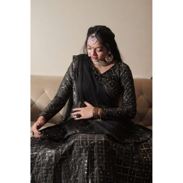 "Elegance Personified: Black Sequence Choli with Lehenga & 2 Dupattas" on rent