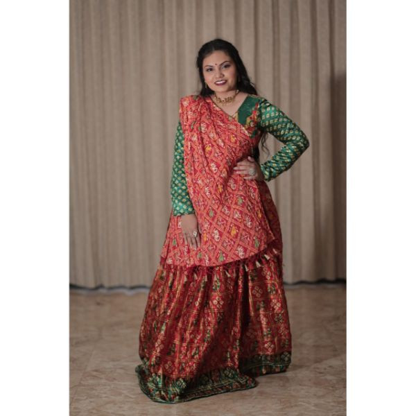 "Vibrant Elegance: Red & Green Bandhani Choli With Lehenga for Rent" on rent